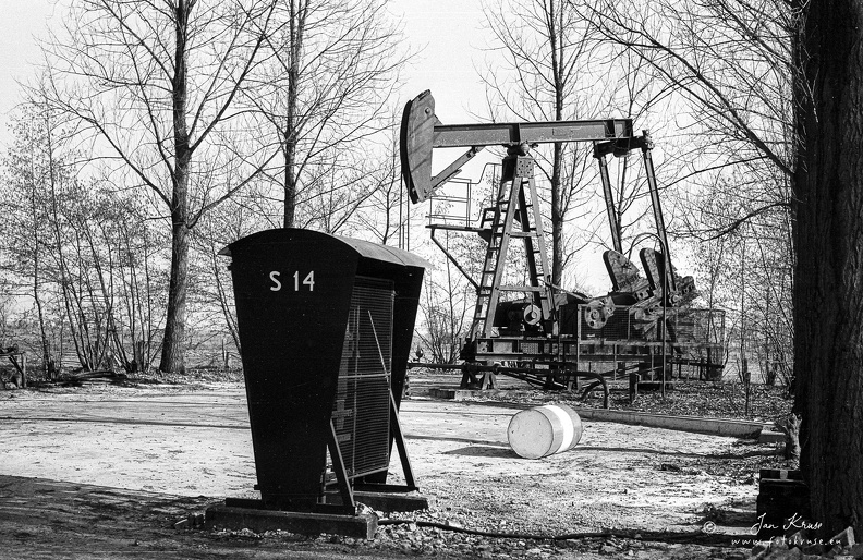 Pumpjack (Hankenhofweg, Schoonebeek, The Netherlands) - GFK-20120402-SCAN-LS50-JBKRUSE-F0020-T301-NEGBW-0004.jpg Pumpjack located in city street in village Schoonebeek in The Netherlands