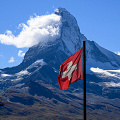 matterhorn-snow-covered-swiss-flag-agains-blue-sky_Z9-9879a.jpg