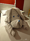 Folded dog sculpture in a Flamenco Beach & Resort hotel room