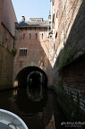 Binnendieze boat passage beneath brick arches