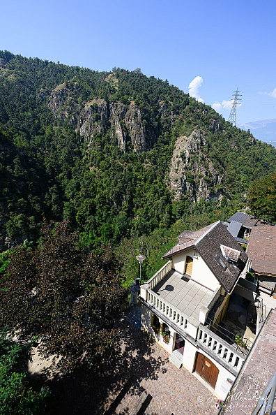 View past Longeborgne buildings and terrace into the deep forested Borgne gorge.