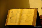 Devotional Book at Ermitage de Longeborgne An open devotional book rests on a lectern inside Ermitage Notre-Dame de Longeborgne, part of the he... Devotional Book at Ermitage de Longeborgne