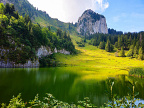 Lac Segray and Tour de Mayen (14 visits) Lac Segray reflects green alpine slopes beneath the vertical limestone tower of Tour de Mayen. Lac Segray and Tour de Mayen