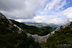 View through the Lapiaz of Truex (8 visits) A natural opening between pale limestone slabs frames green Vaud alpine pastures and distant mountai... View through the Lapiaz of Truex