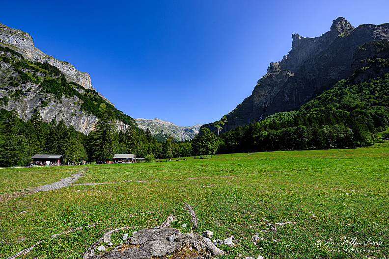 Mountain peak Corne du Chamois (Chamois Horns) rising high from the green meadow at Cirque du Fer à Cheval