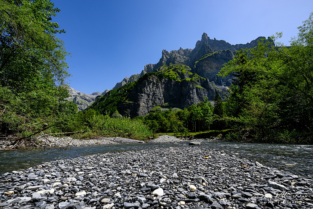 Mountain peak Corne du Chamois (Chamois Horns, 2523m) seen from the river Le Giffre
