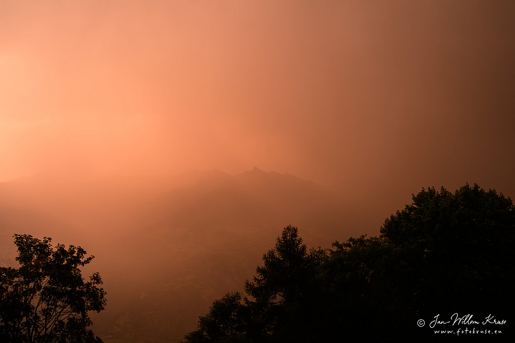Dramatic sky during thunderstorm at sunset in Val d'Hérens (Switzerland)