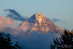 Last Light on a Cloud-Wrapped Summit