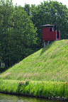 Historic Outhouse over the Moat at Bourtange (6 visits) One of Bourtange’s red wooden historic outhouse structures projects above the water beside the gra... Historic Outhouse over the Moat at Bourtange